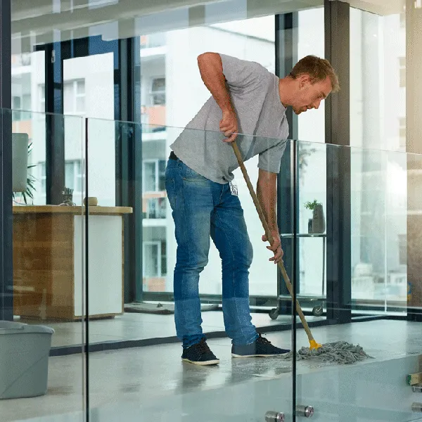 housekeeper cleaning floor